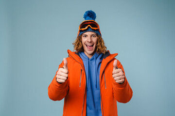 Young excited sportsman showing thumbs up on camera