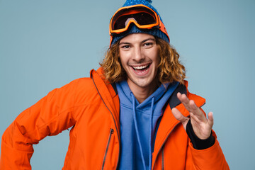 Caucasian joyful sportsman smiling and dancing on camera