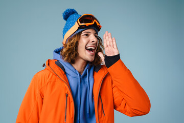 Caucasian joyful sportsman looking and screaming aside