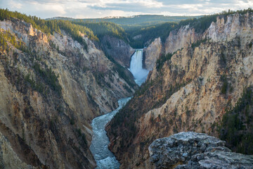 lower falls of the yellowstone national park from artist point at sunset, wyoming, usa