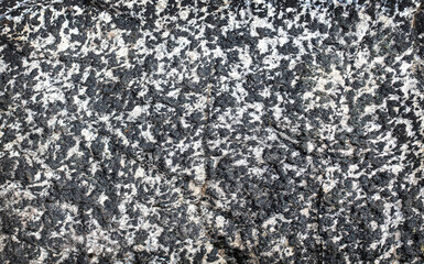 Dark grey black stone background or texture. Selective focus