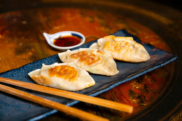 Cooking delicious original Japanese meat Gyozas.