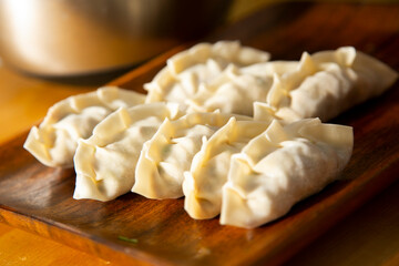 Cooking delicious original Japanese meat Gyozas.