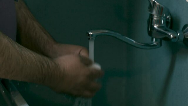 Frontliner Washing Hands With Soap And Tap Water In The Hospital - Coronavirus Proper Hygiene - close up