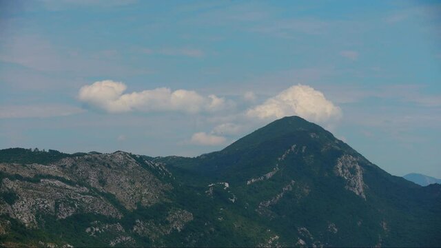 timelapse in the mountains, the sun is shining