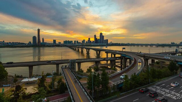 time-lapse. best view Traffic at Yeouido District and Han river during sunset in Seoul, South Korea.(zoom in)