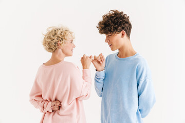 Woman made up by pinky with brother while showing diddle gesture