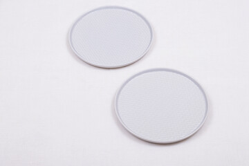 Two empty plates on a light tablecloth.