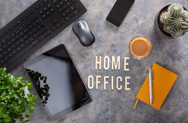 home office text desk with keyboard computer smartphone notebook houseplants, workspace at home