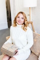 Woman holding gift, holiday gift, Christmas and new year preparation