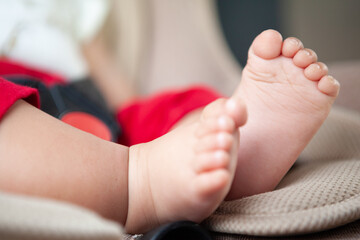 foot of the baby on car seat