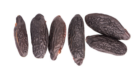 Tonka beans isolated on white background. Bean of Dipteryx odorata, cumaru or kumaru. Fresh aroma tonka beans. Close-up. Top view.
