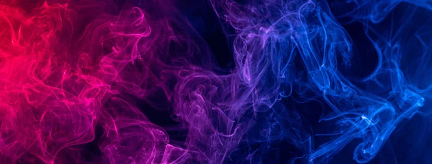 Raamstickers Conceptueel beeld van kleurrijke rode en blauwe kleur rook op donkere zwarte achtergrond. © RomixImage