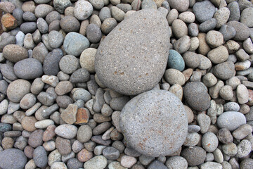 Big stones among smaller pebbles, in the garden