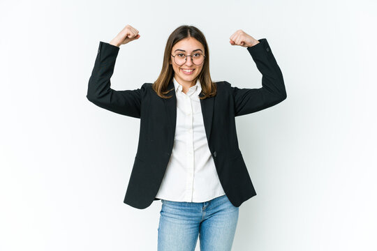 Young Caucasian Business Woman Showing Strength Gesture With Arms, Symbol Of Feminine Power