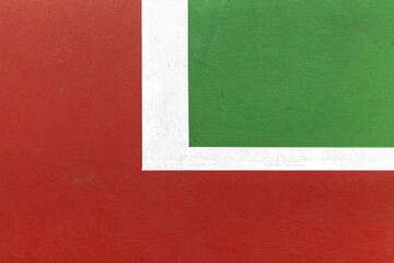 A close up of white lines on the tennis court floor