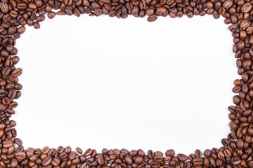 Frame made of fresh roasted coffee beans. Copy space. Top view.