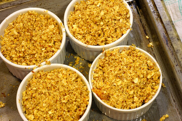 Apple and oat crumbles in individual ramekins