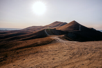Landscape of hills at dawn with road