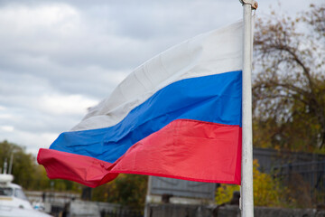 The Russian flag, growing in the wind. Flag of the Russian Federation