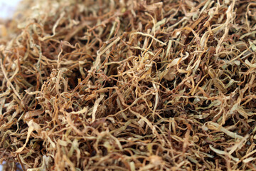 The brown tobacco flakes that grow in Indonesia.