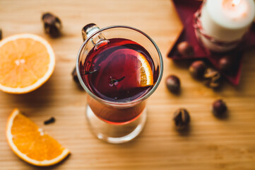 Red hot wine with spices, Christmas hot spicy drink. Seasonal mulled wine. Mulled wine with orange...