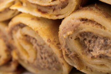 Meat stuffed crepes close-up. Macro shot.