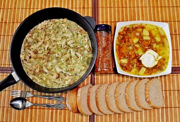 Chanterelle mushrooms stewed with chicken rye bread spices Chanterelle soup on a bamboo tablecloth dinner with friends, Top view