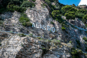 Alassio, Italian roman city of the Ligurian riviera, in summer days with blue sky