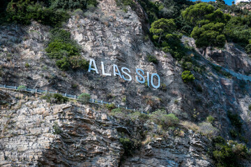 Alassio, Italian roman city of the Ligurian riviera, in summer days with blue sky