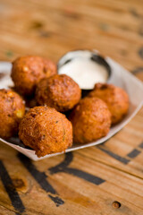 Hush puppies. Deep fried cornmeal made with onions, garlic and butter. Classic Cajun cuisine appetizer favorite. Classic New Orleans cuisine.