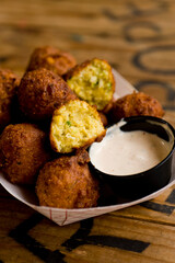 Hush puppies. Deep fried cornmeal made with onions, garlic and butter. Classic Cajun cuisine appetizer favorite. Classic New Orleans cuisine.