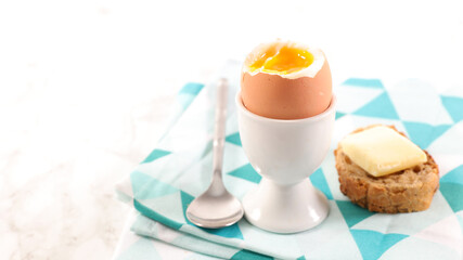 soft boiled egg and bread with butter