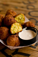 Hush puppies. Deep fried cornmeal made with onions, garlic and butter. Classic Cajun cuisine appetizer favorite. Classic New Orleans cuisine.