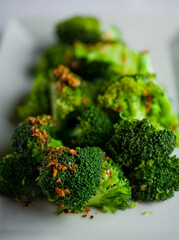Steakhouse side dishes. Asparagus, salad, tomatoes, mashed potatoes, red onions, cream cauliflower, pickled peppers, seasoned meats served in cast iron skillet. Traditional appetizer items.