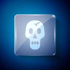 White Skull icon isolated on blue background. Happy Halloween party. Square glass panels. Vector.