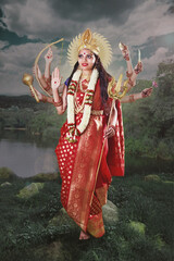 Indian Goddess Durga with eight hands standing near the lake