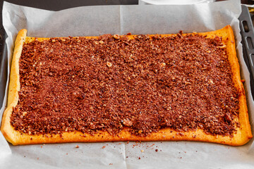 The process of making cookies from shortcrust pastry, chocolate and marshmallows.
