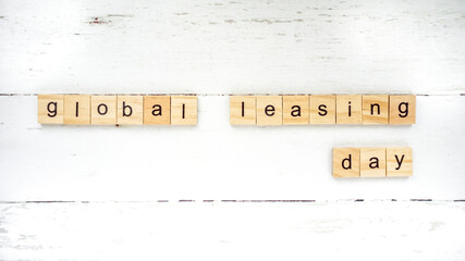 Global Leasing Day. leasing versus credit.words from wooden cubes with letters photo