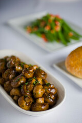 Mushrooms roasted in garlic, onions, olive oil and fresh herbs and spices. Classic American steakhouse or French bistro appetizer or side dish.