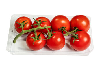 Fresh juicy tomato on a vine in a plastic container on a white background. Produce product
