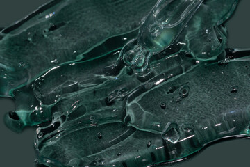 transparend gel texture on an emerald green background