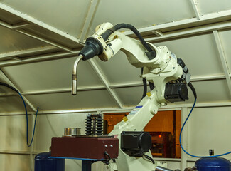 Robots welding in parts industry
