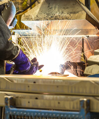 Industrial steel welder in factory