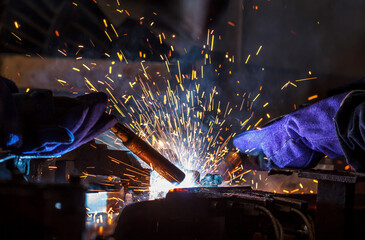 Industrial steel welder in factory