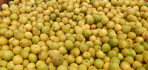 A lot of lemons in a market