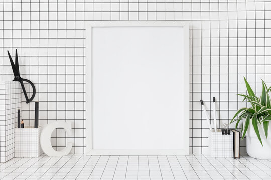 Poster frame mockup, chequered supplies and checkered wall.