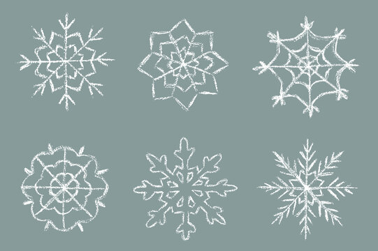 Crayon snowflakes colletion. Children drawing chalk style snowflake set.  Hand drawn wax crayons art. Happy New year and Merry Christmas snowflakes. Color pastel crayons  freehand drawn snowflake.