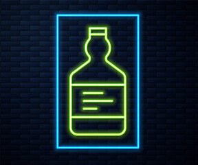 Glowing neon line Tequila bottle icon isolated on brick wall background. Mexican alcohol drink. Vector.