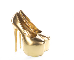 gold female shoes on a white background